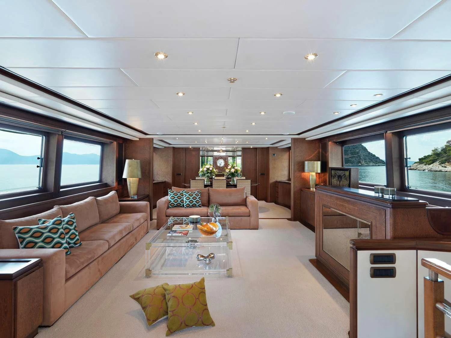 a living room with a couch and a table aboard IDYLLE Yacht for Sale