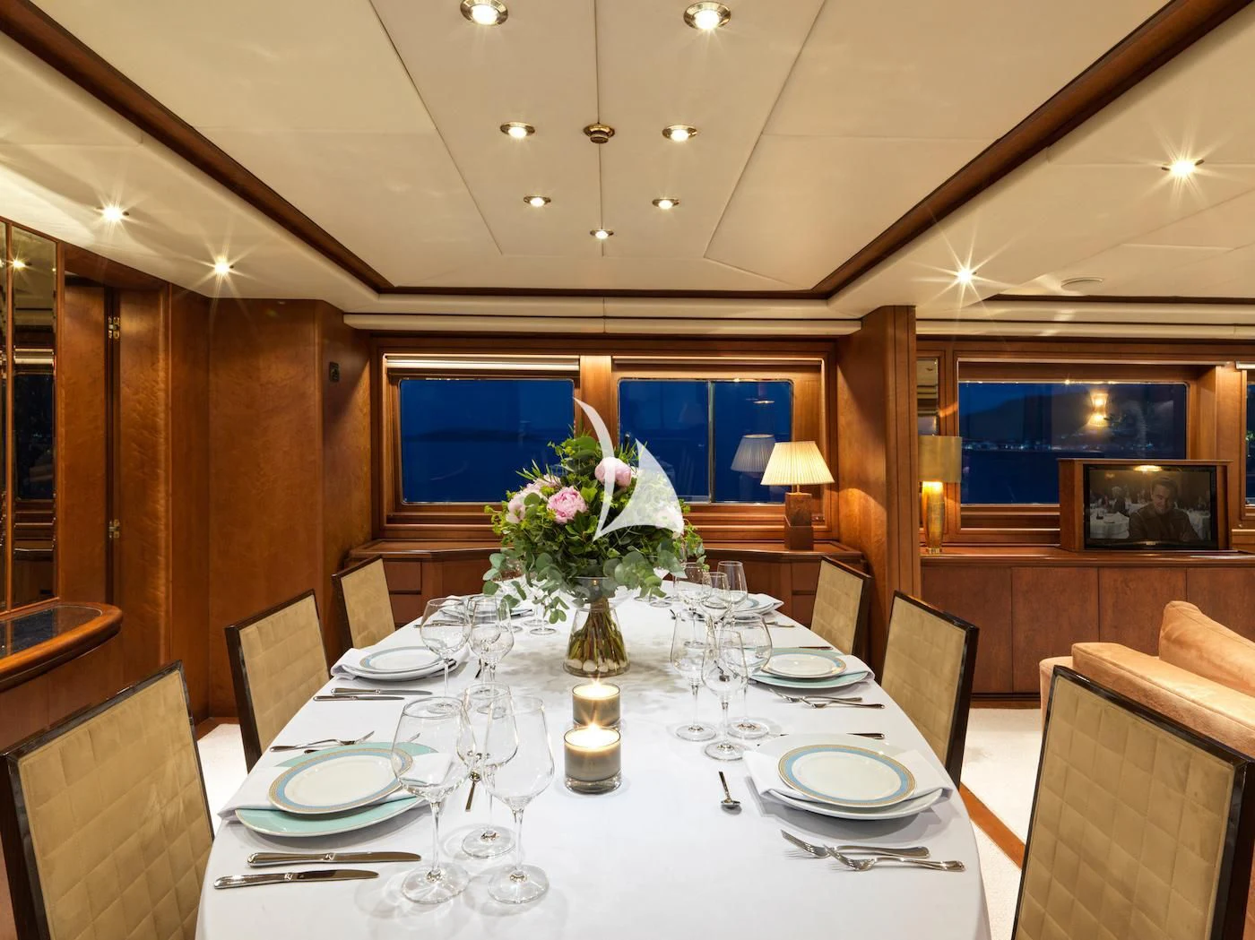 a dining room with a table set aboard IDYLLE Yacht for Sale