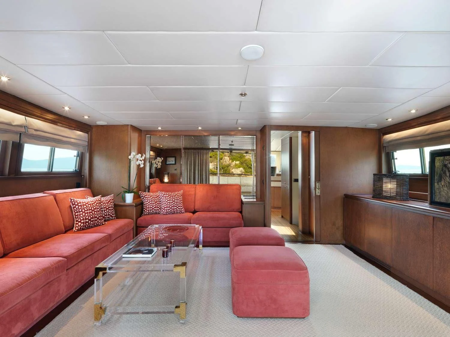 a living room with a couch and a table aboard IDYLLE Yacht for Sale