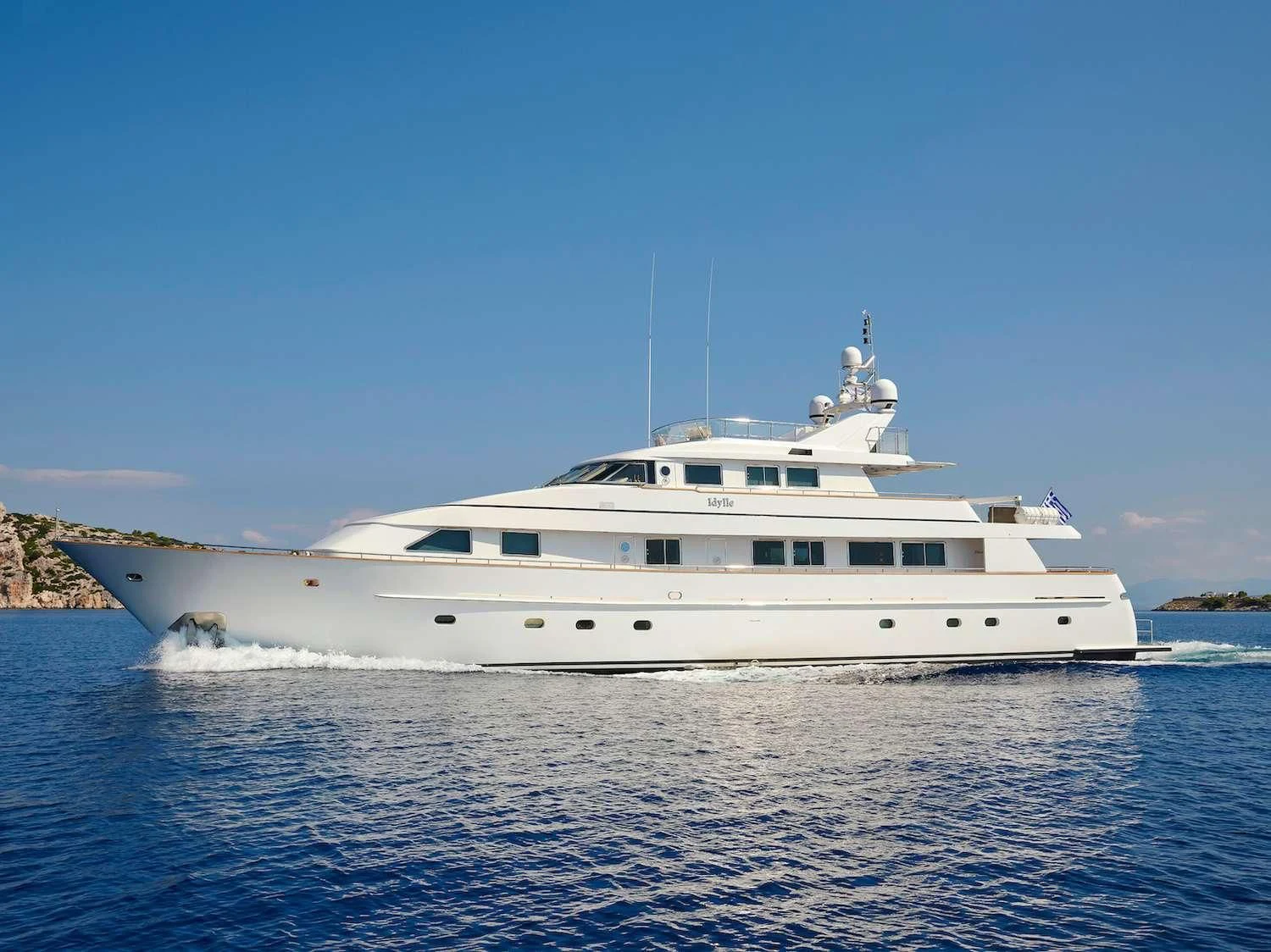 a white yacht on the water aboard IDYLLE Yacht for Sale