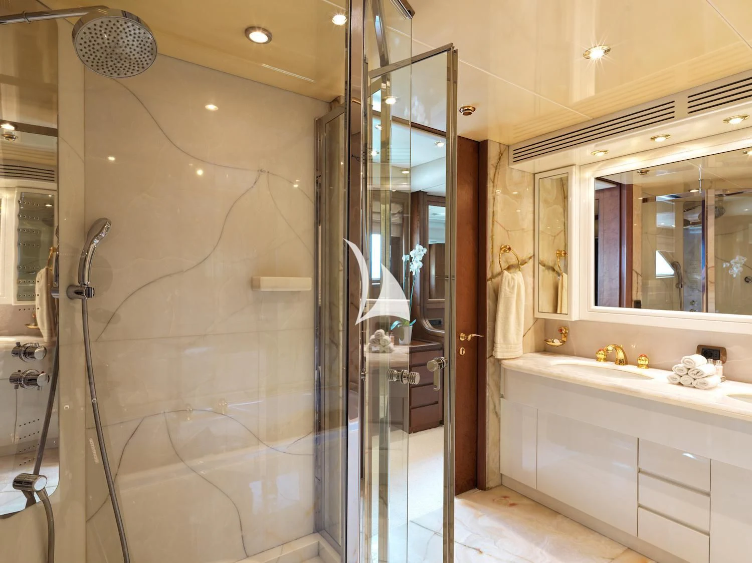 a bathroom with a glass shower aboard IDYLLE Yacht for Sale