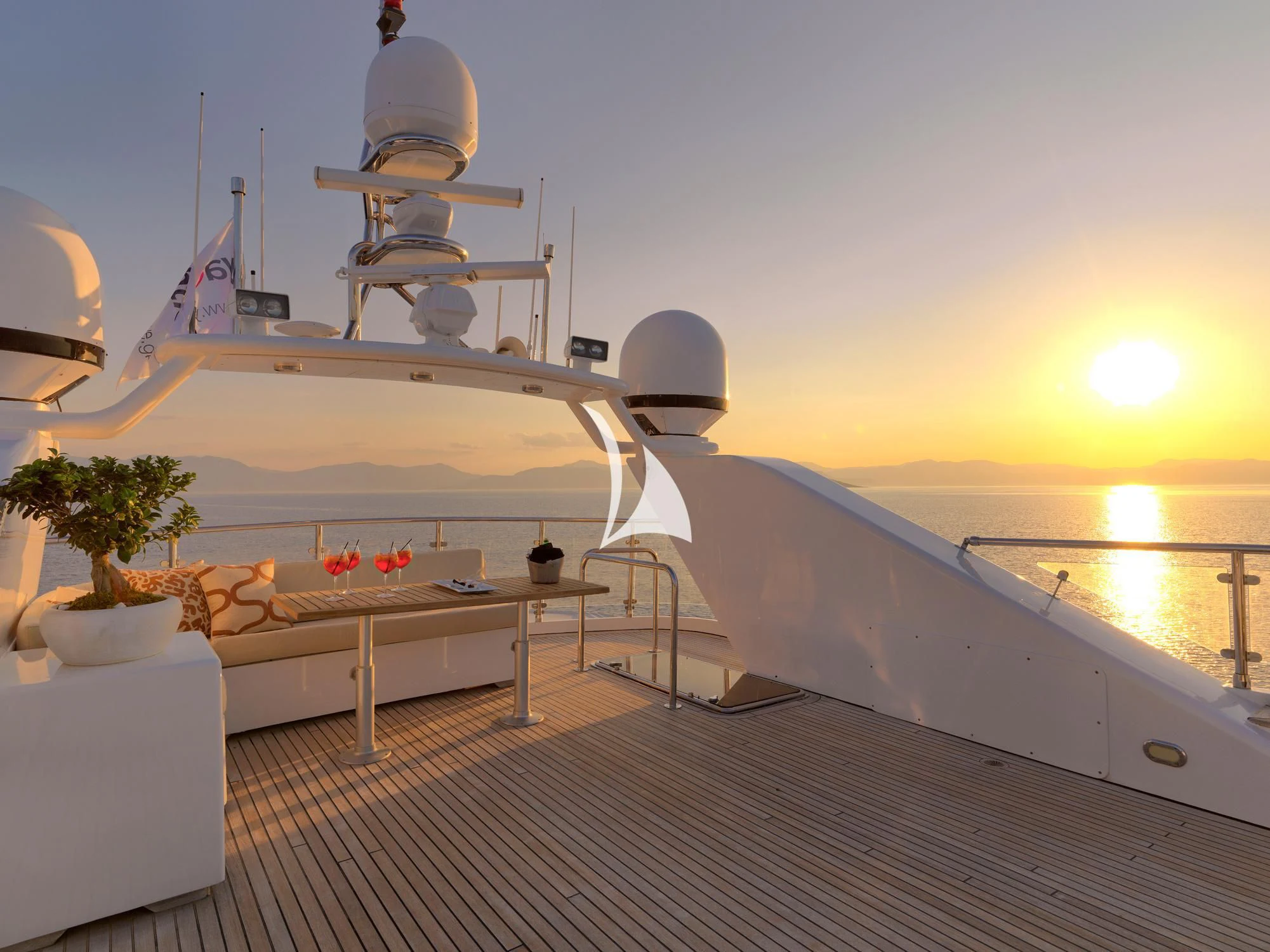 a white lounge chair on a deck aboard IDYLLE Yacht for Sale