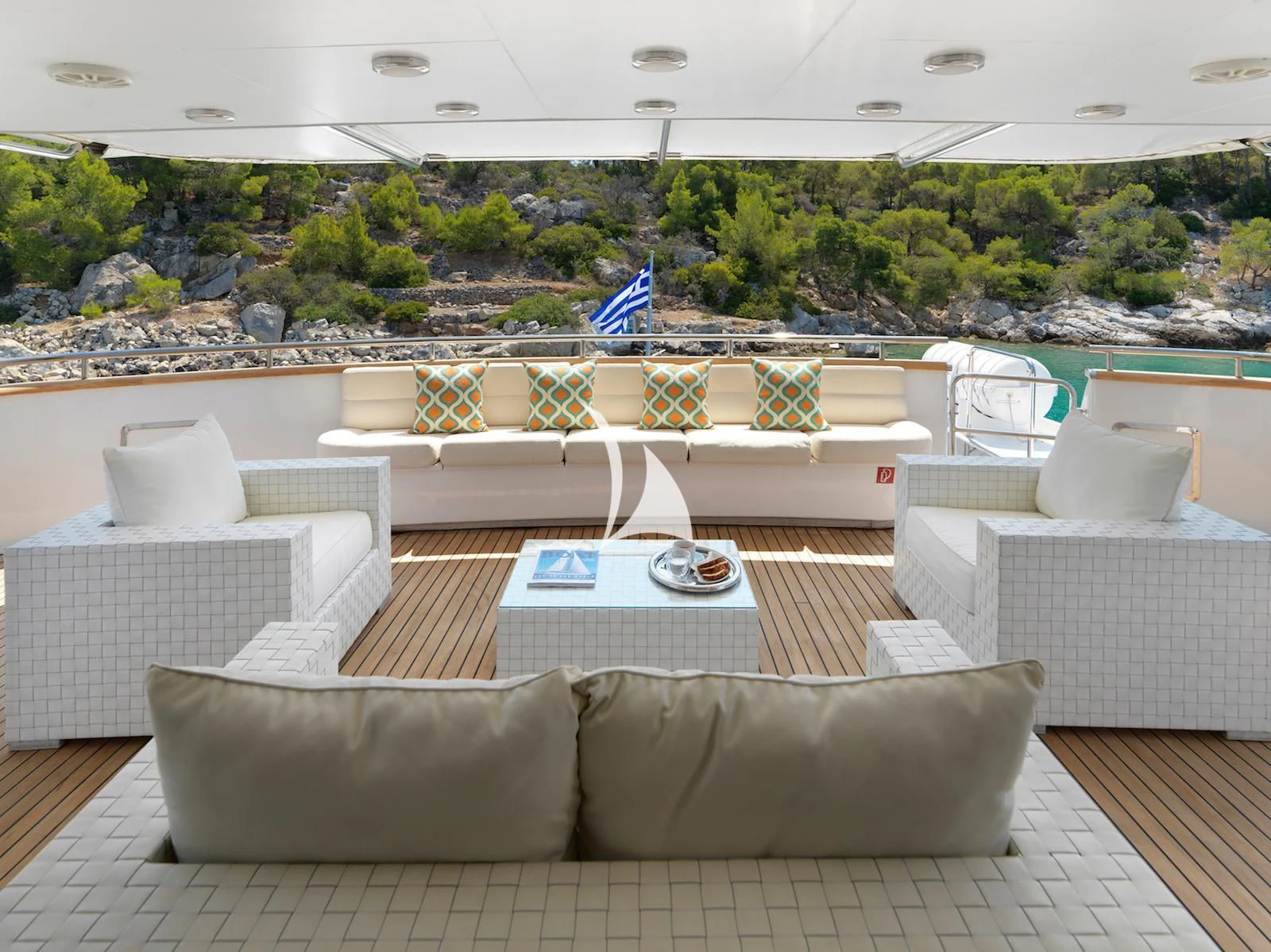 a patio with couches and chairs aboard IDYLLE Yacht for Sale