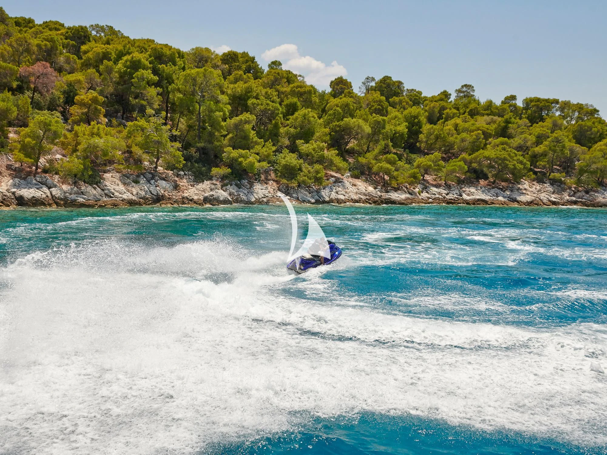 a person surfing on the waves aboard IDYLLE Yacht for Sale
