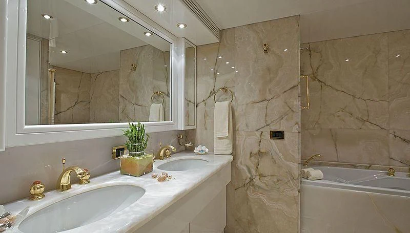 a bathroom with a large mirror aboard IDYLLE Yacht for Sale