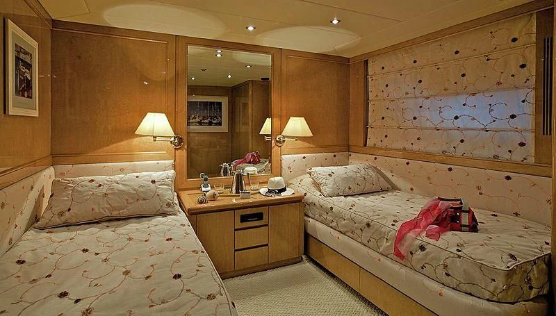 a couple of beds in a hotel room aboard IDYLLE Yacht for Sale