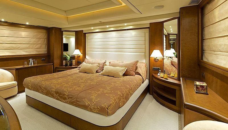 a large bed in a hotel room aboard IDYLLE Yacht for Sale