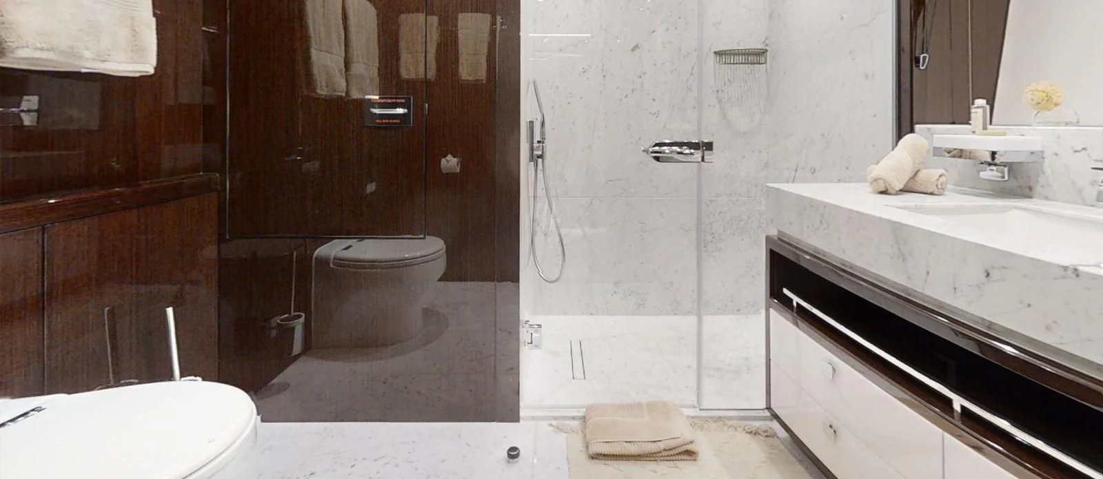 a bathroom with a toilet sink and a bathtub aboard NOAH Yacht for Charter