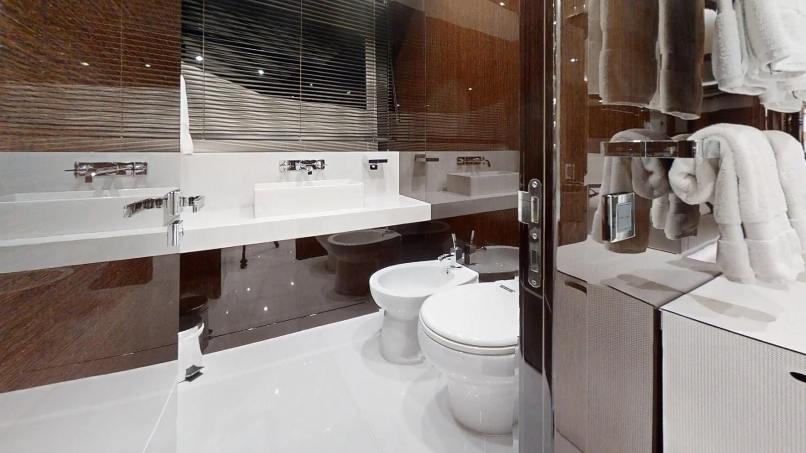 a bathroom with a tub sink and toilet aboard NOAH Yacht for Charter