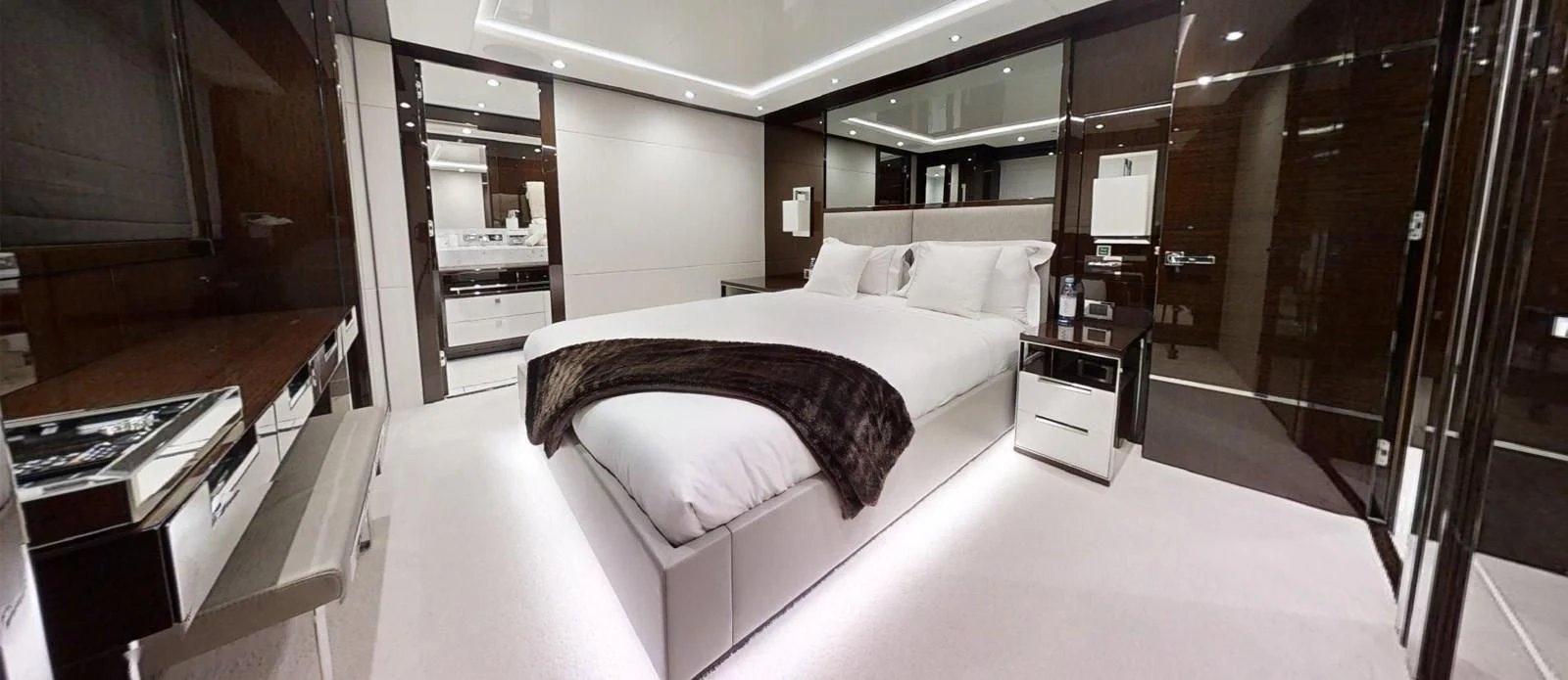 a large bedroom with a bed aboard NOAH Yacht for Charter