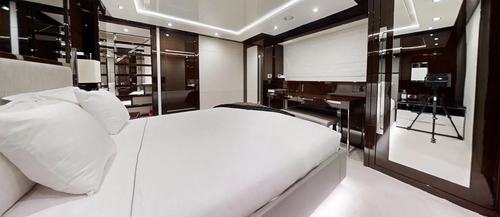 a bed in a room aboard NOAH Yacht for Charter