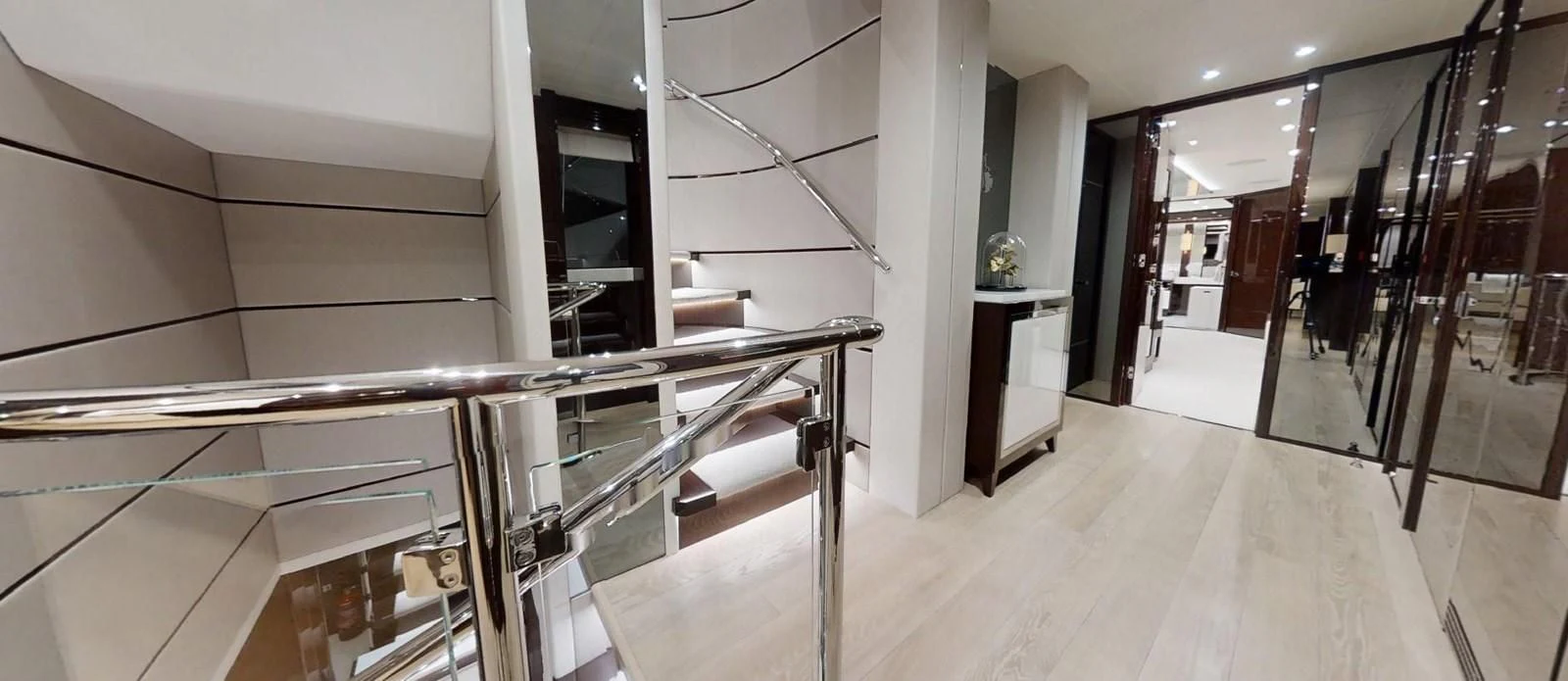 a room with a staircase and a desk aboard NOAH Yacht for Charter