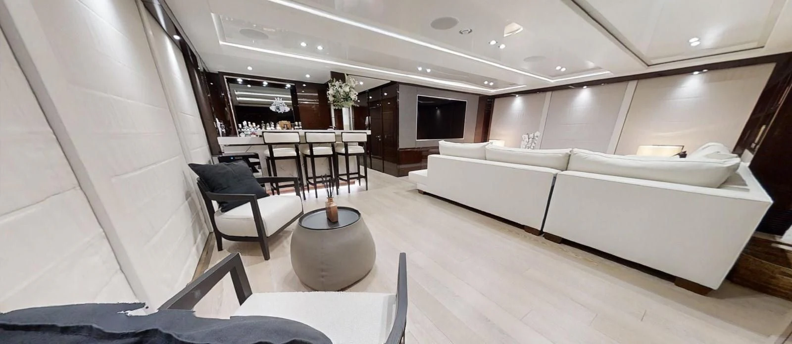 a room with a couch and a table aboard NOAH Yacht for Charter