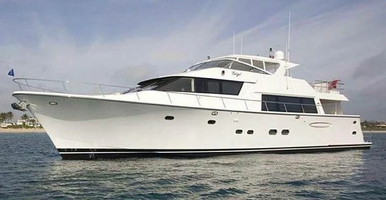 a white yacht in the water aboard ESCAPE Yacht for Sale
