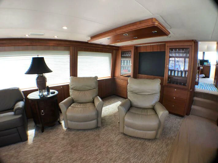 a living room with a couch and a television aboard ESCAPE Yacht for Sale
