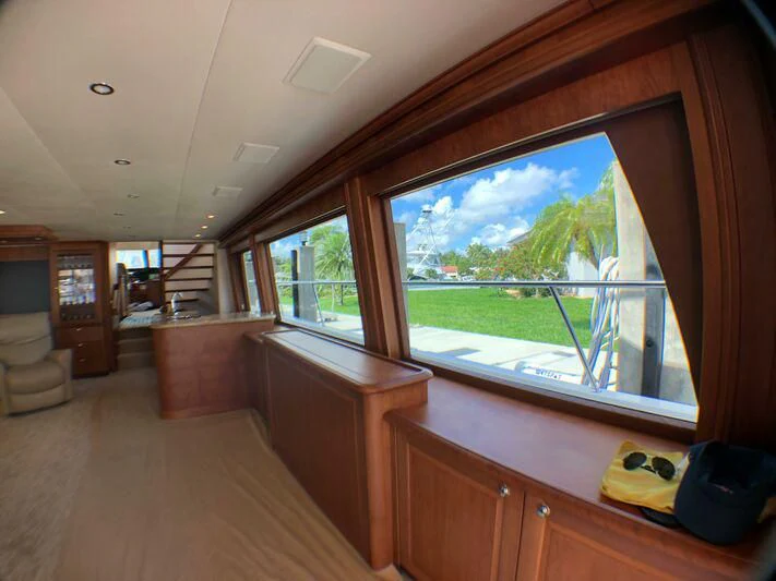 a room with a large window and a view of the water aboard ESCAPE Yacht for Sale