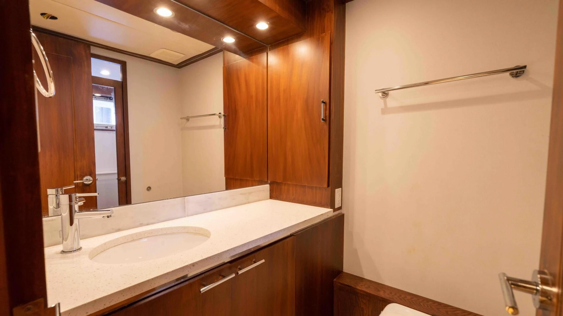 a bathroom with a countertop sink and mirror aboard ARIES Yacht for Sale
