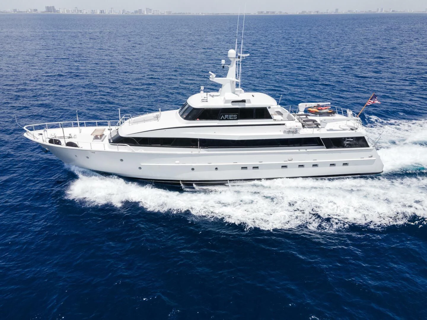 a white yacht on the water aboard ARIES Yacht for Sale