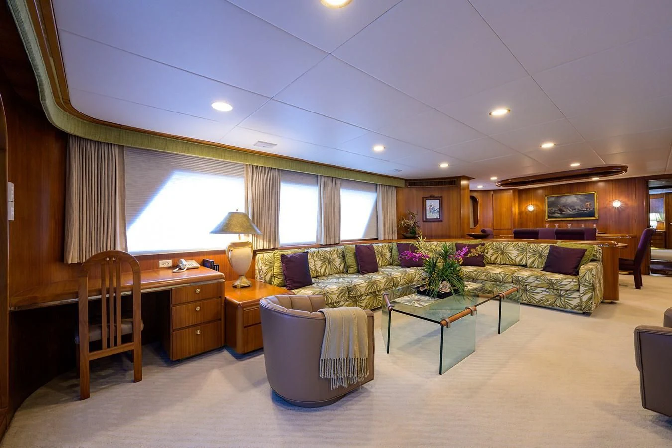 a living room with a couch and a coffee table aboard ARIES Yacht for Sale