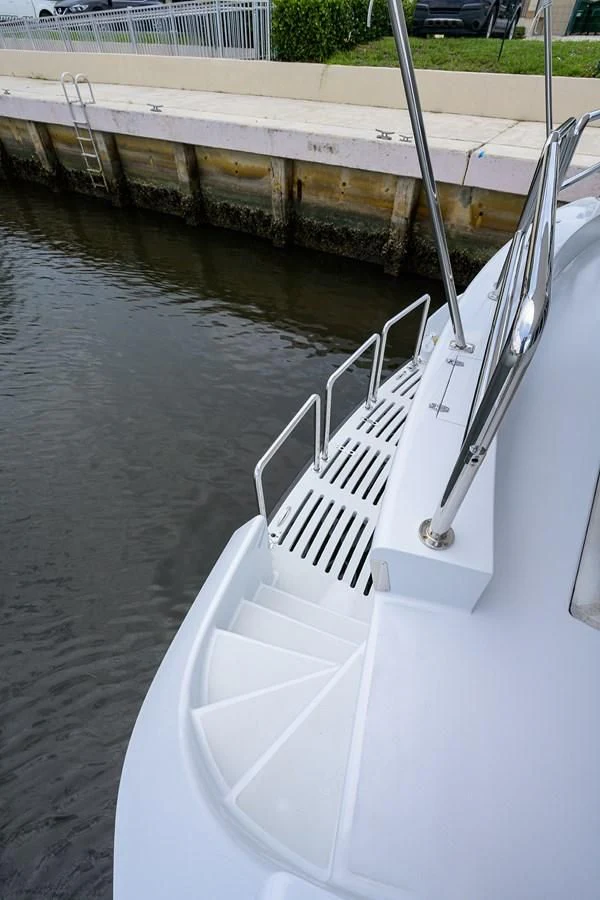 a white boat in a body of water aboard ARIES Yacht for Sale