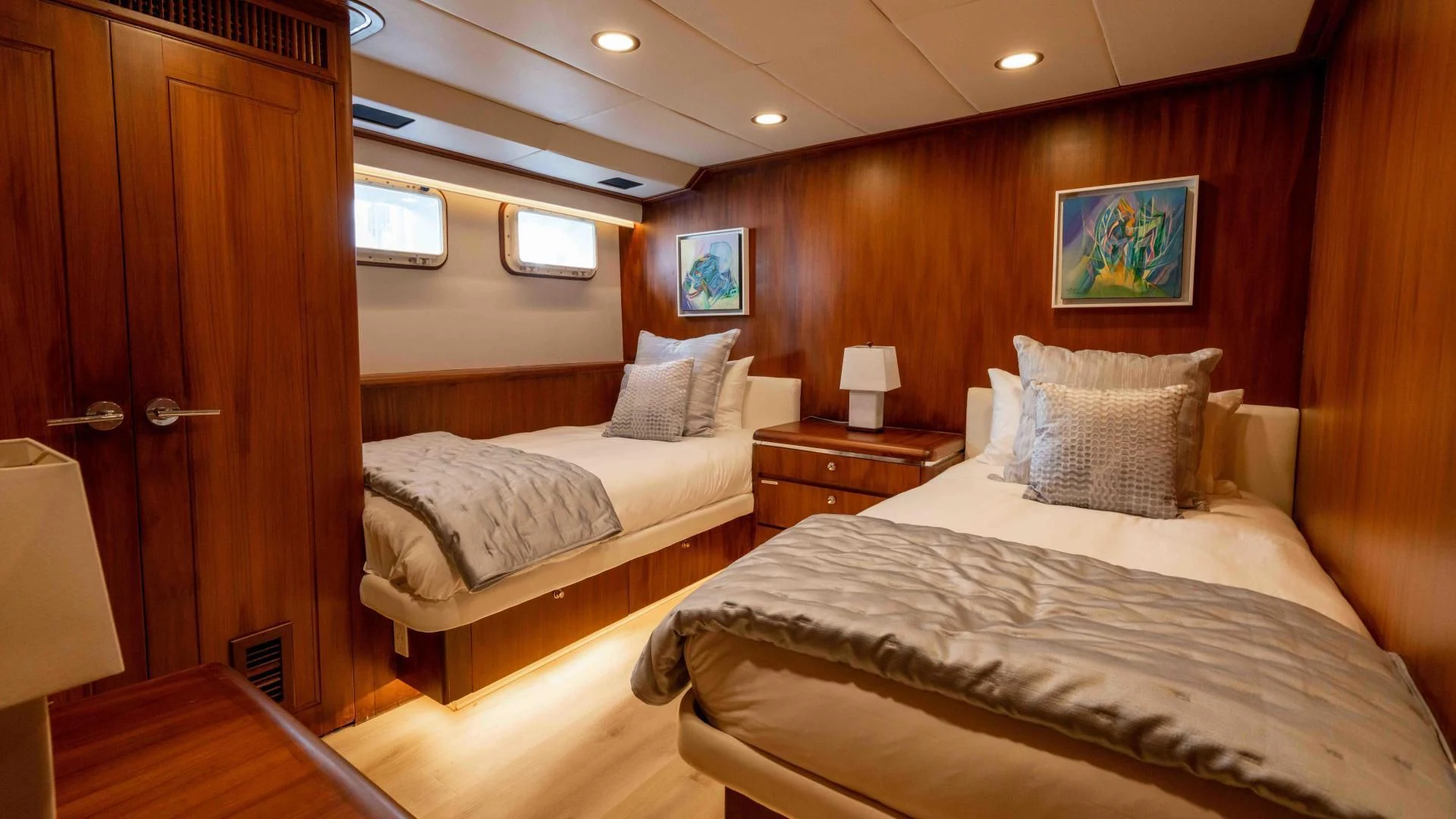 a room with two beds aboard ARIES Yacht for Sale
