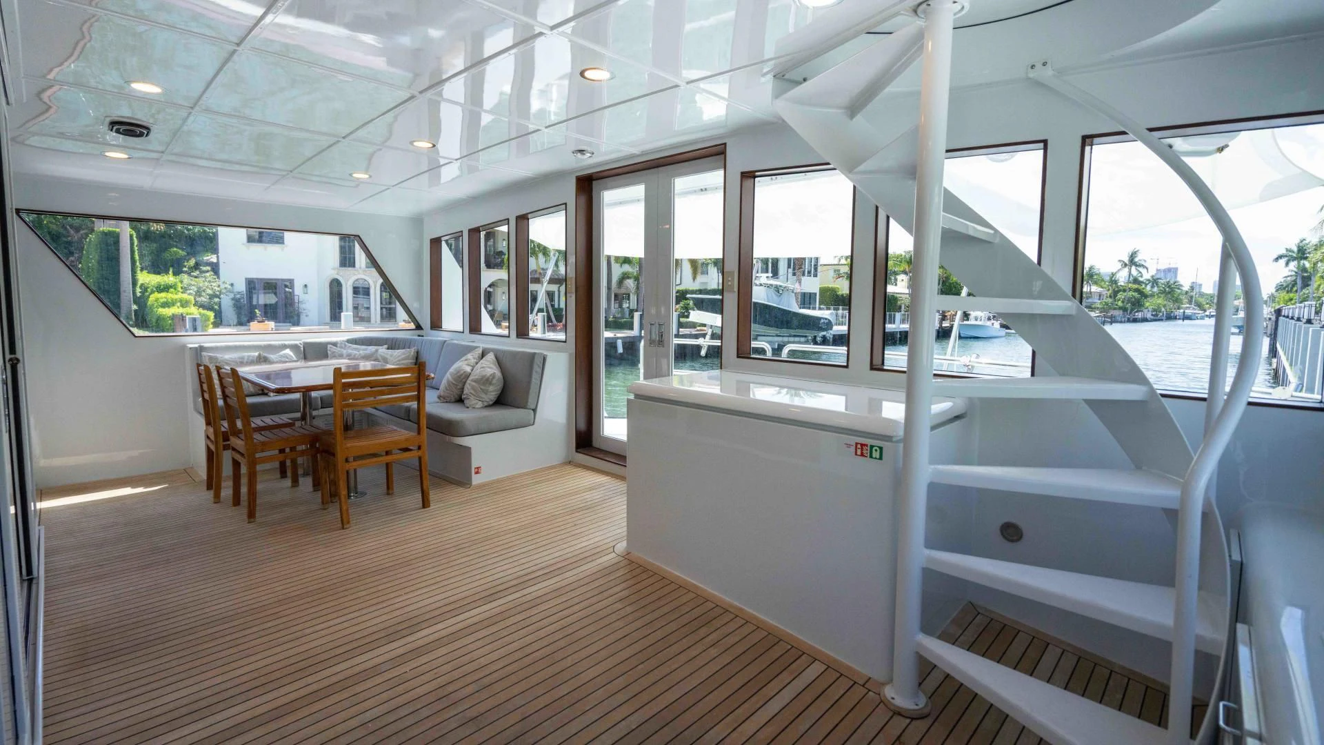 a room with a table and chairs aboard ARIES Yacht for Sale