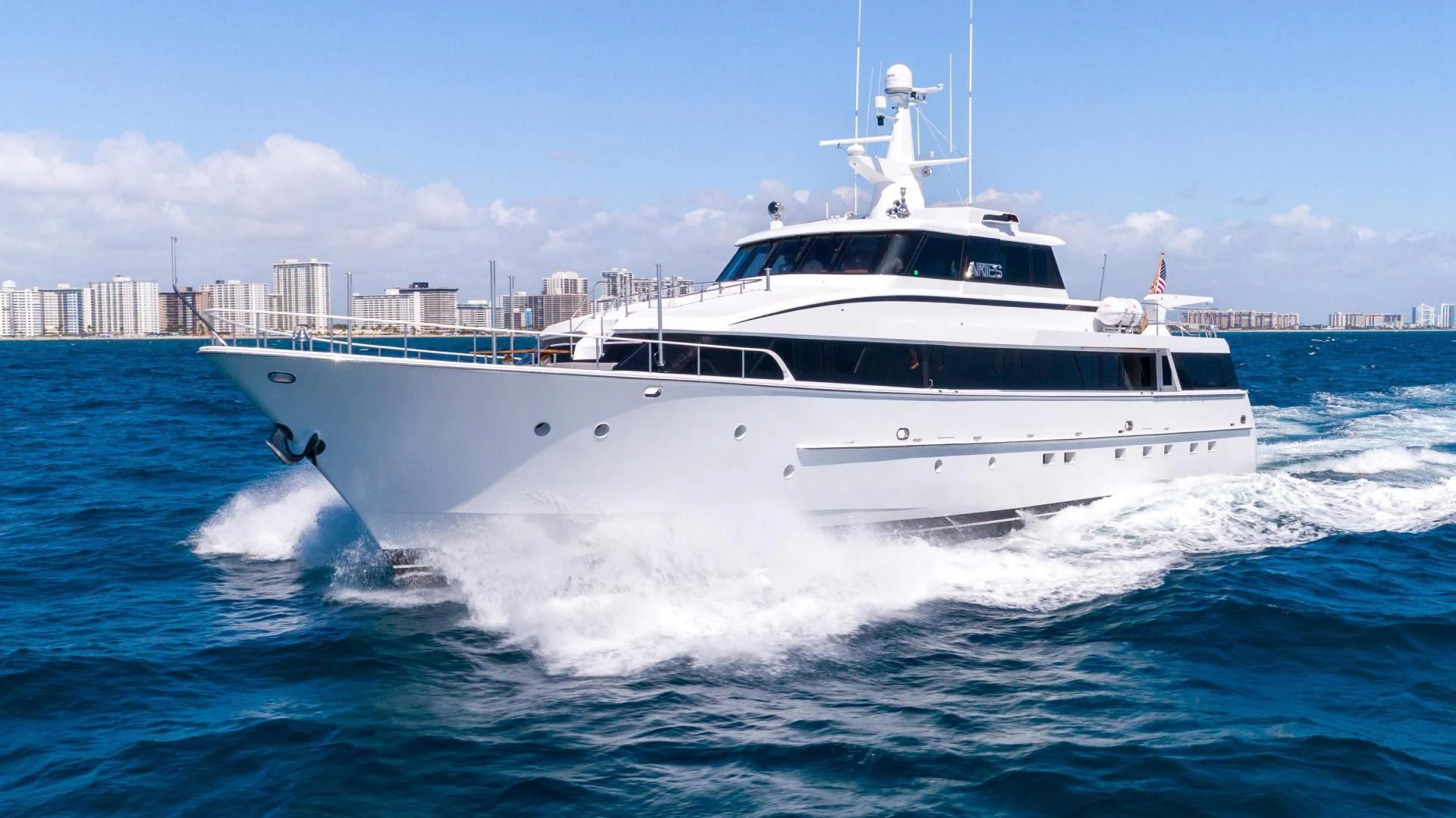 a white yacht on the water aboard ARIES Yacht for Sale
