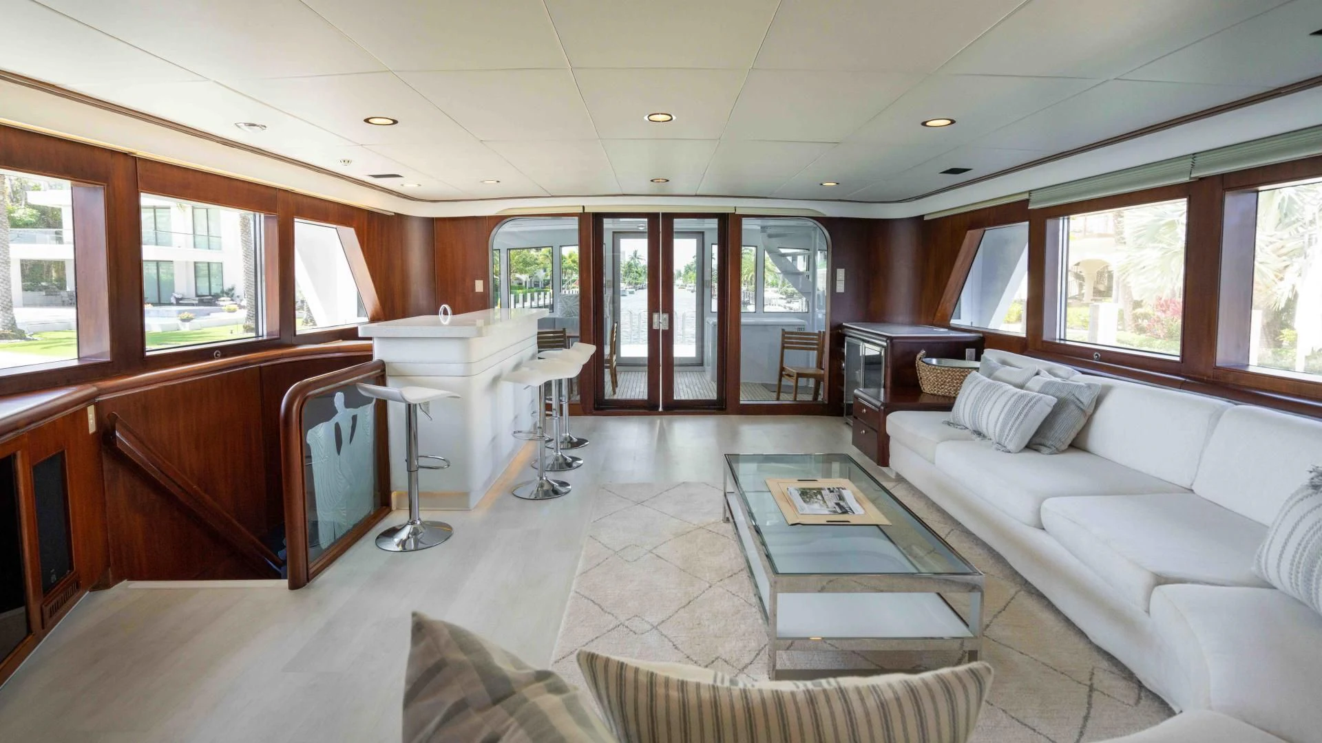 a living room with a couch and a table aboard ARIES Yacht for Sale