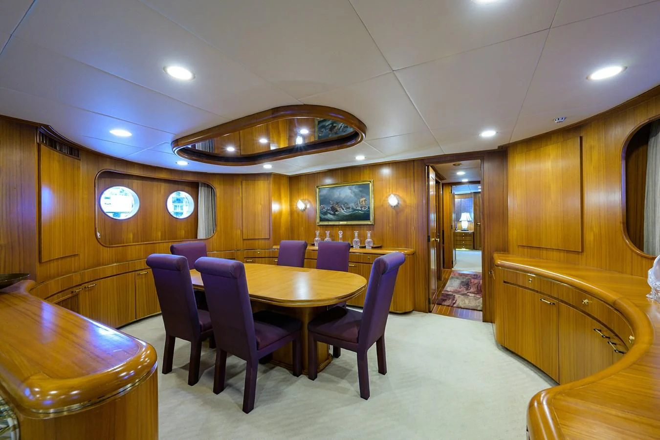 a room with a table and chairs aboard ARIES Yacht for Sale