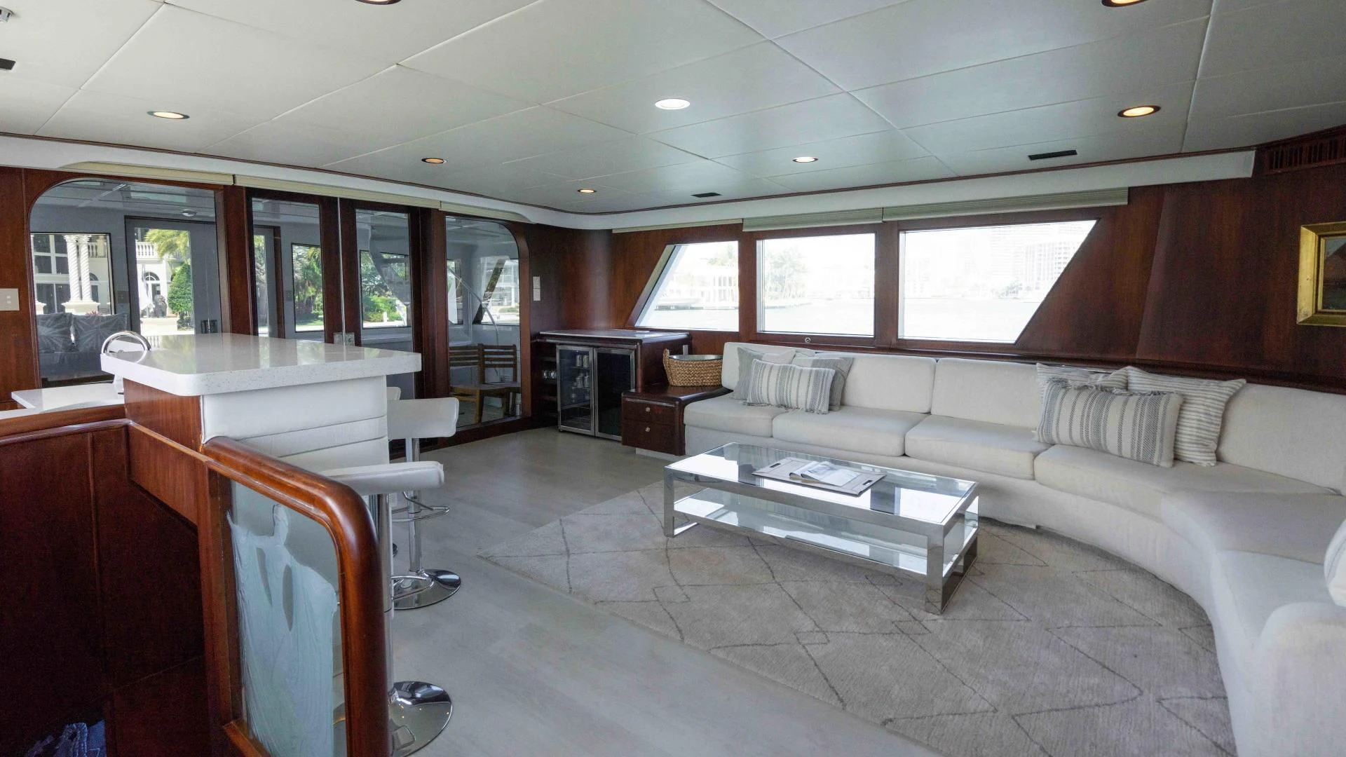 a living room with a couch and a table aboard ARIES Yacht for Sale