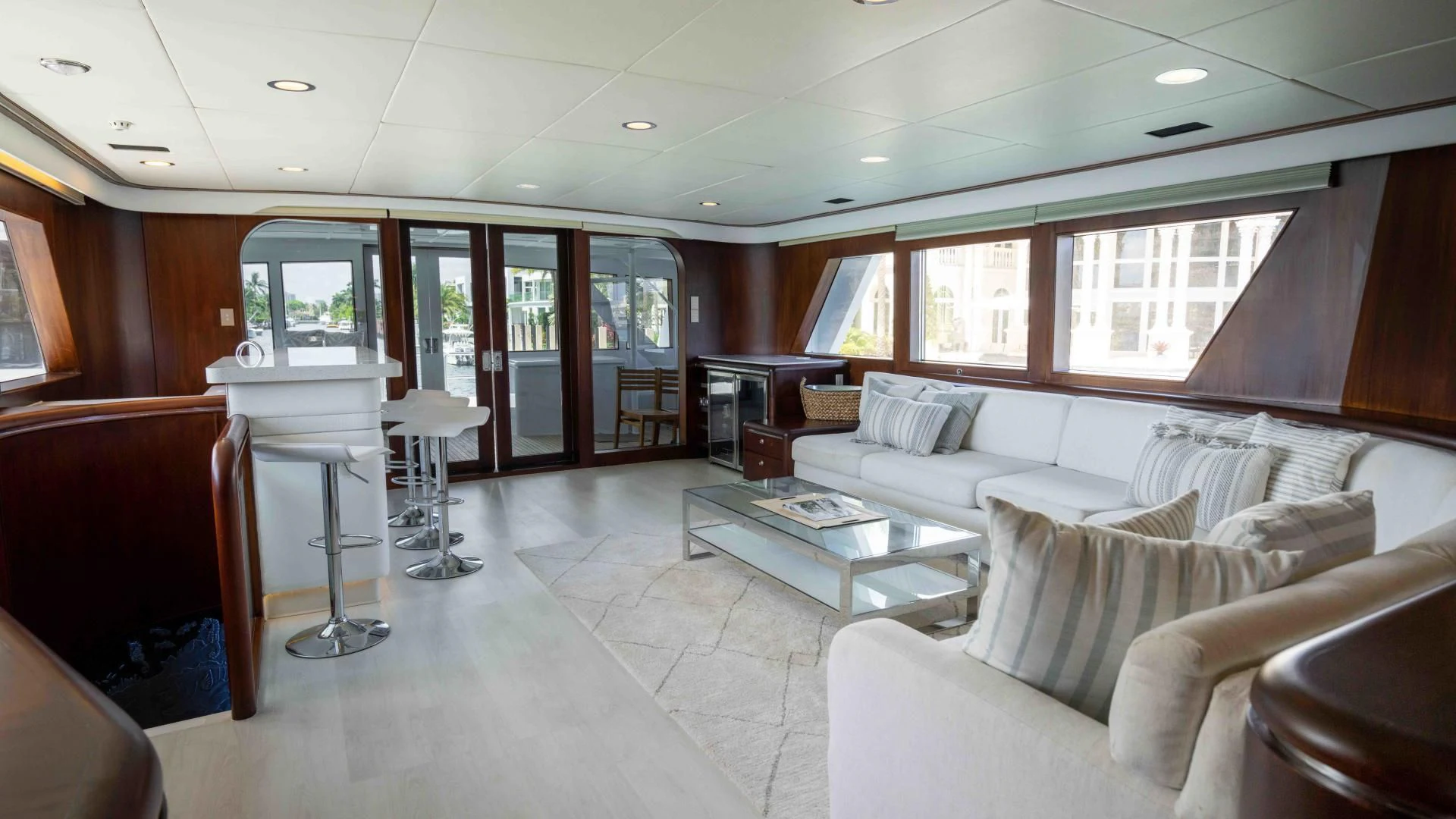 a living room with a couch and a table aboard ARIES Yacht for Sale