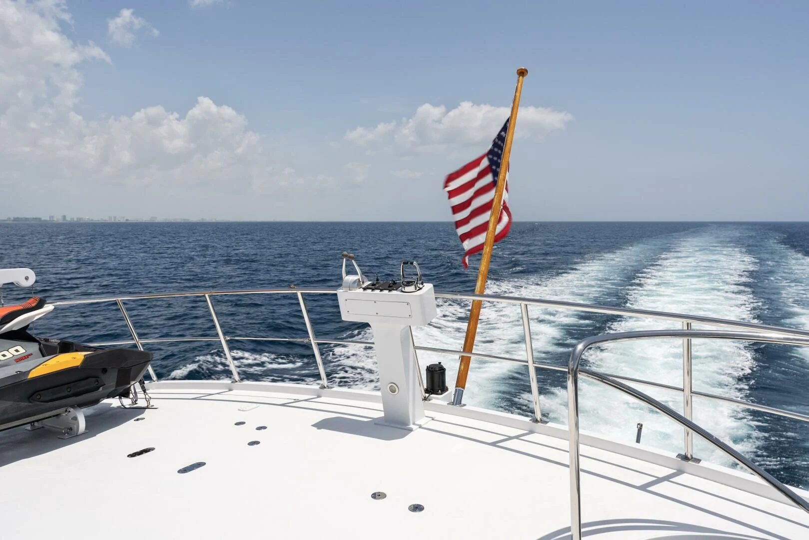 a boat with a flag on it aboard ARIES Yacht for Sale