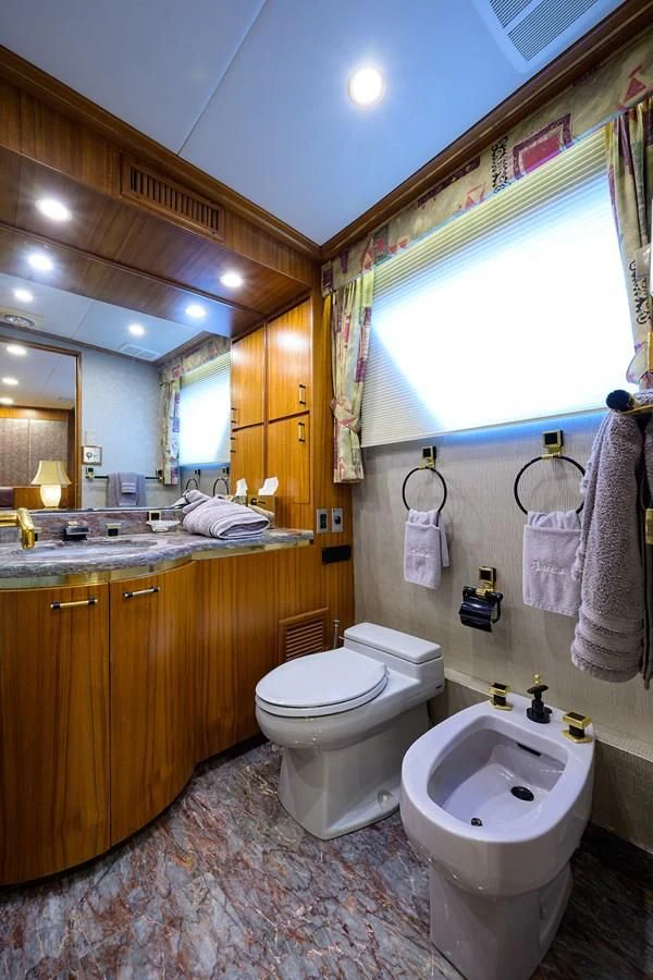 a bathroom with a toilet and a sink aboard ARIES Yacht for Sale