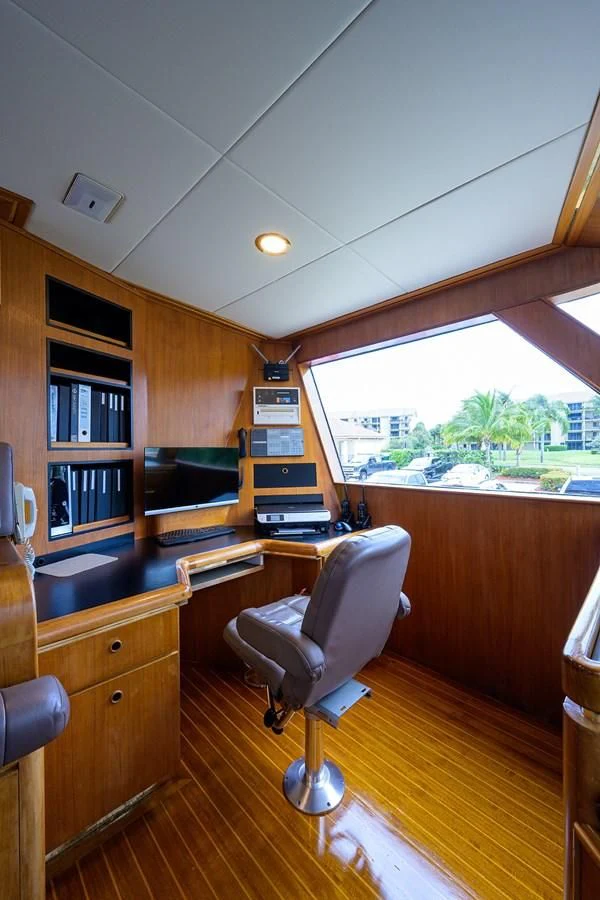a room with a chair and a table and a tv aboard ARIES Yacht for Sale