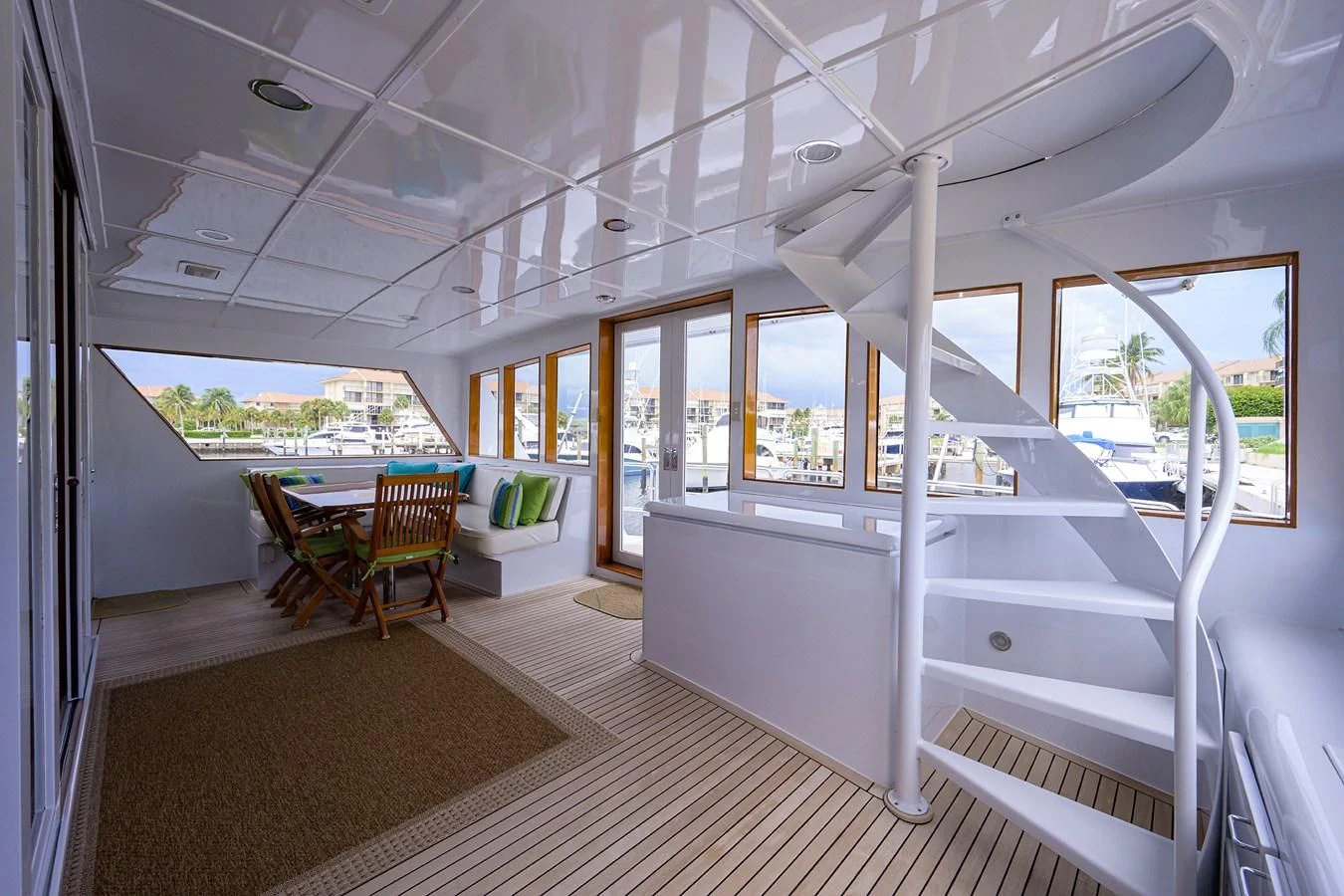 a room with a bunk bed and a table and chairs aboard ARIES Yacht for Sale