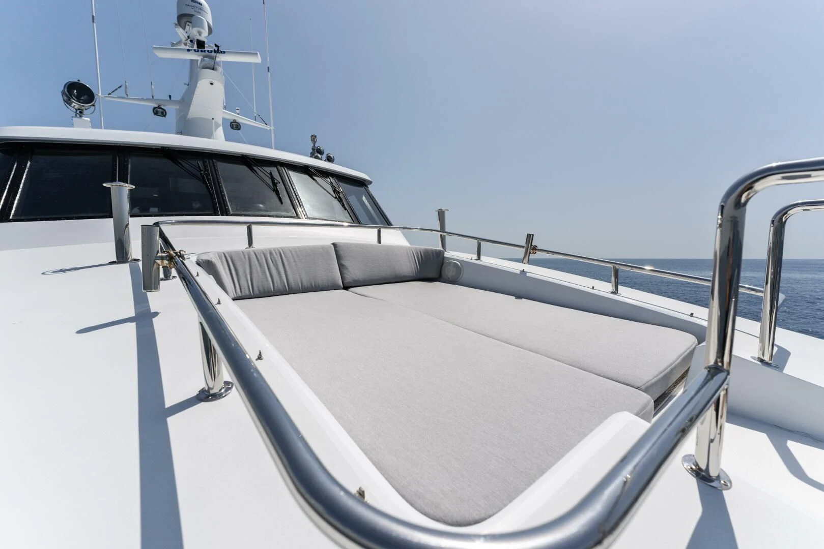 a white boat with a white sail aboard ARIES Yacht for Sale
