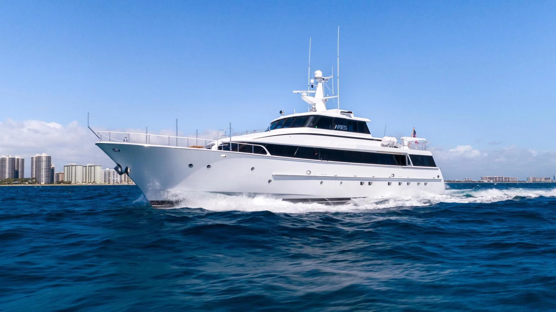 a white yacht in the water aboard ARIES Yacht for Sale