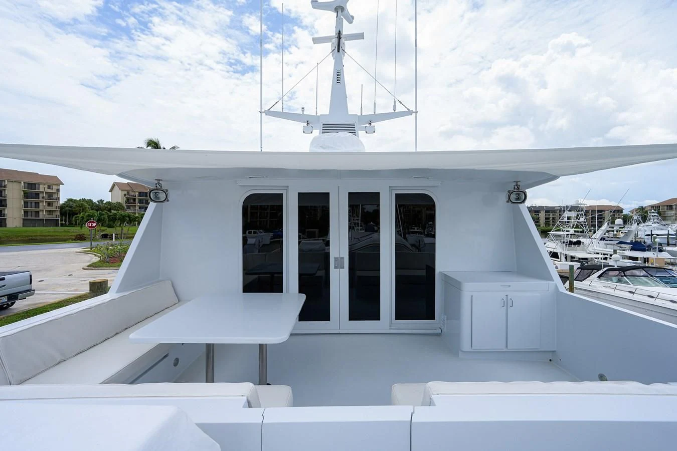 a white building with a white roof and a white tower on top aboard ARIES Yacht for Sale