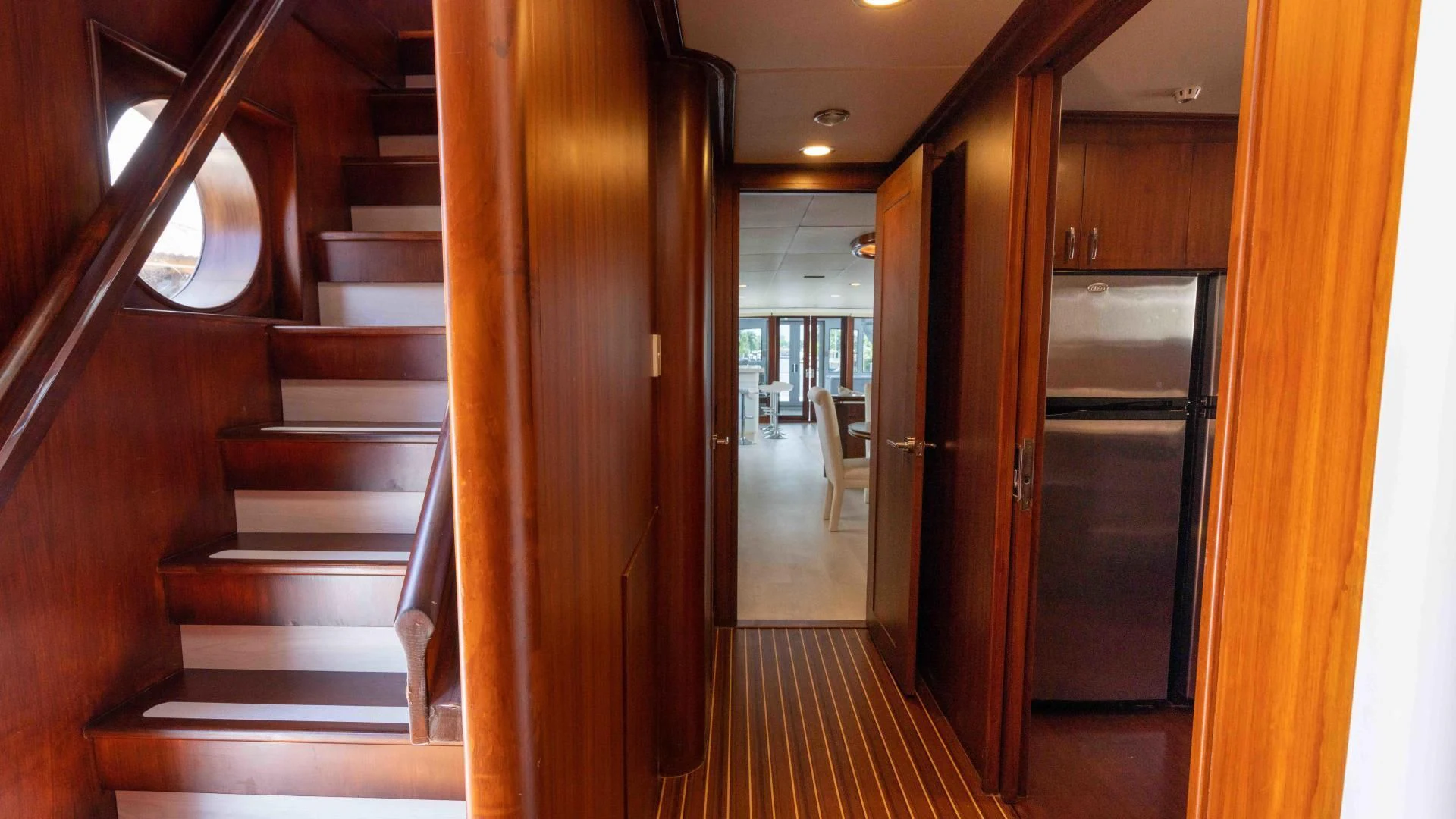 a wooden staircase in a building aboard ARIES Yacht for Sale