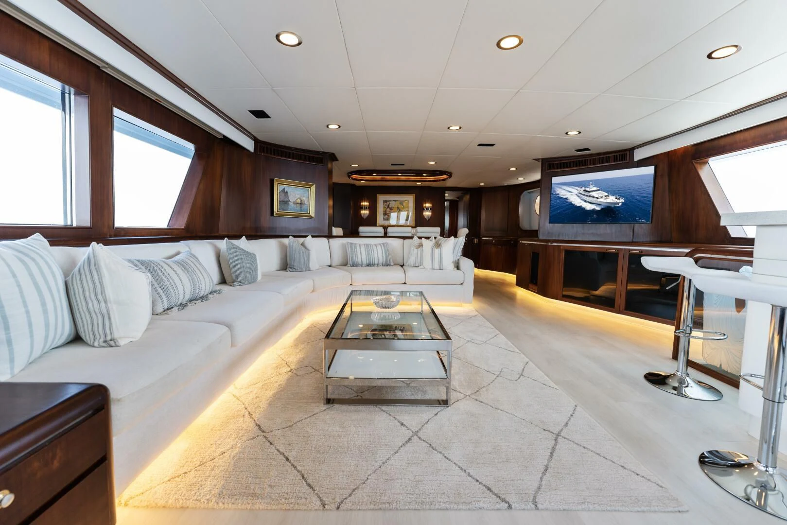a living room with a large screen aboard ARIES Yacht for Sale