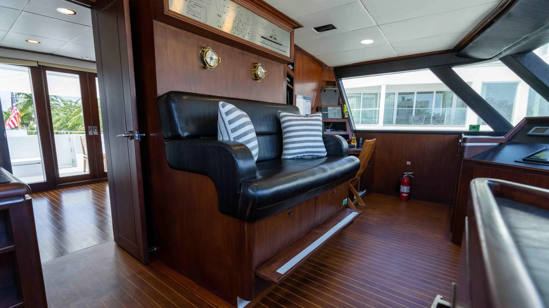 a living room with a leather couch aboard ARIES Yacht for Sale