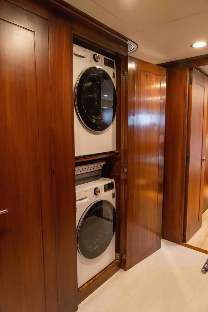 a washer and dryer in a room aboard ARIES Yacht for Sale