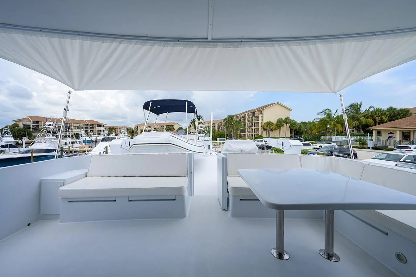 a group of white tables aboard ARIES Yacht for Sale