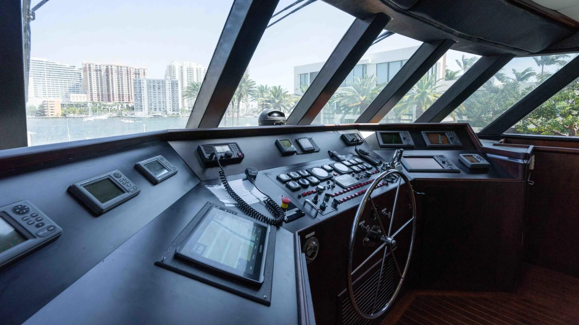 a car with a screen and a phone on the dashboard aboard ARIES Yacht for Sale
