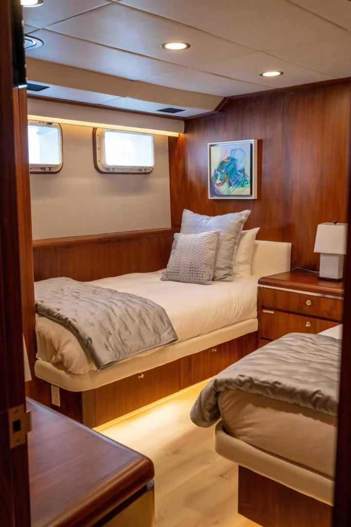 a room with two beds aboard ARIES Yacht for Sale