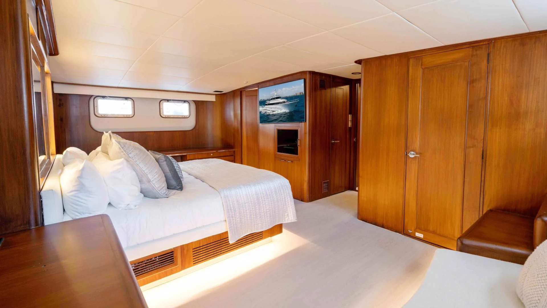 a room with a bed and a desk aboard ARIES Yacht for Sale