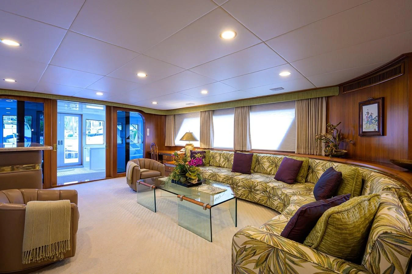 a living room with a couch and a coffee table aboard ARIES Yacht for Sale