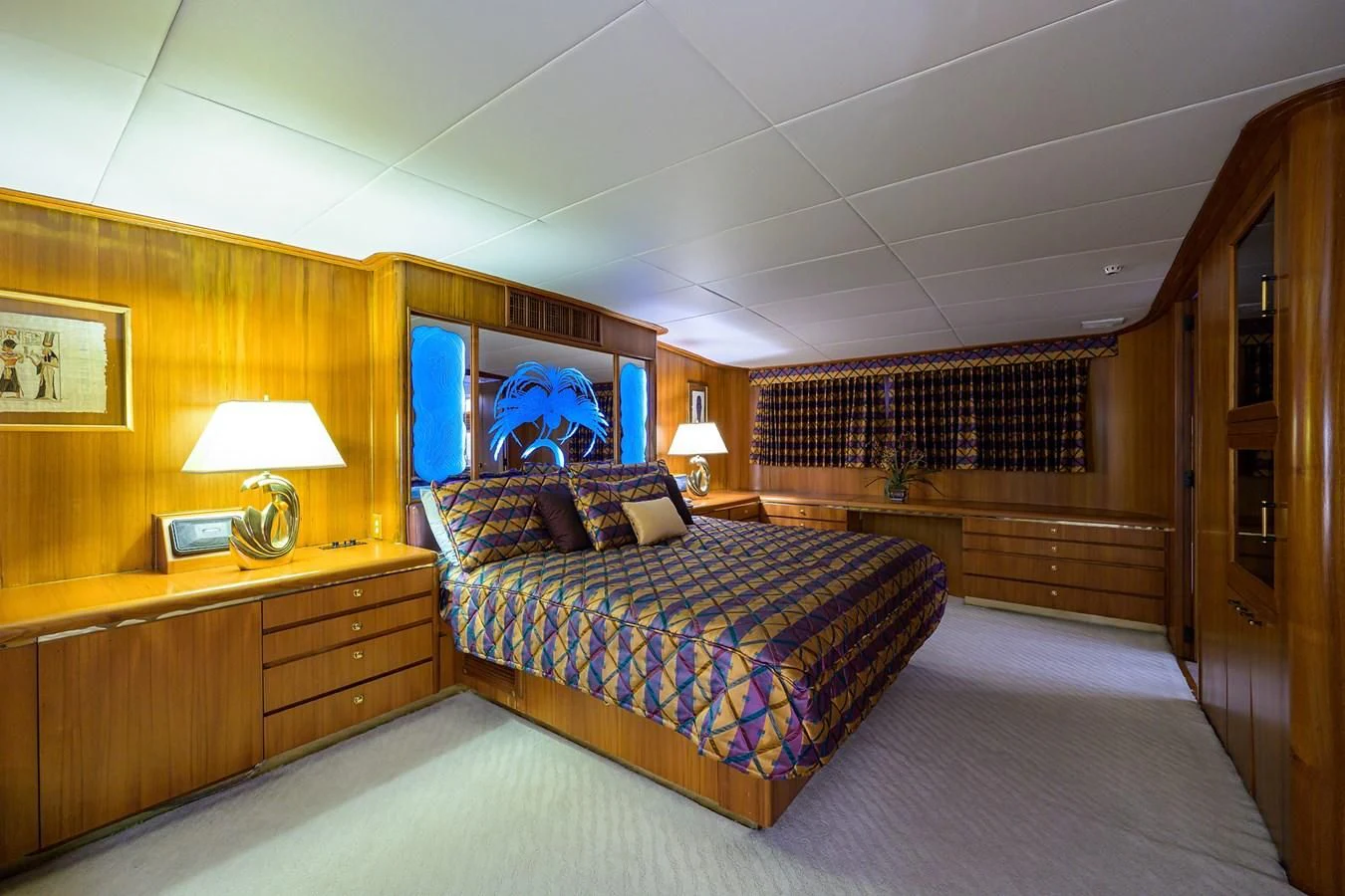 a bedroom with a bed and a desk aboard ARIES Yacht for Sale