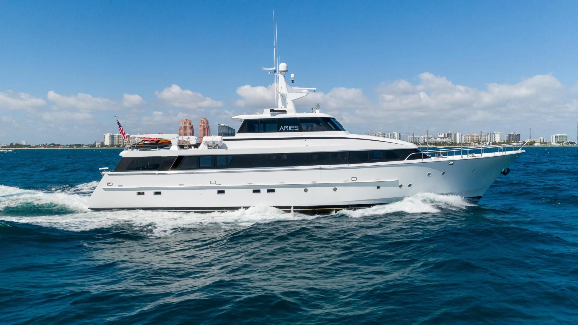 a white yacht in the water aboard ARIES Yacht for Sale