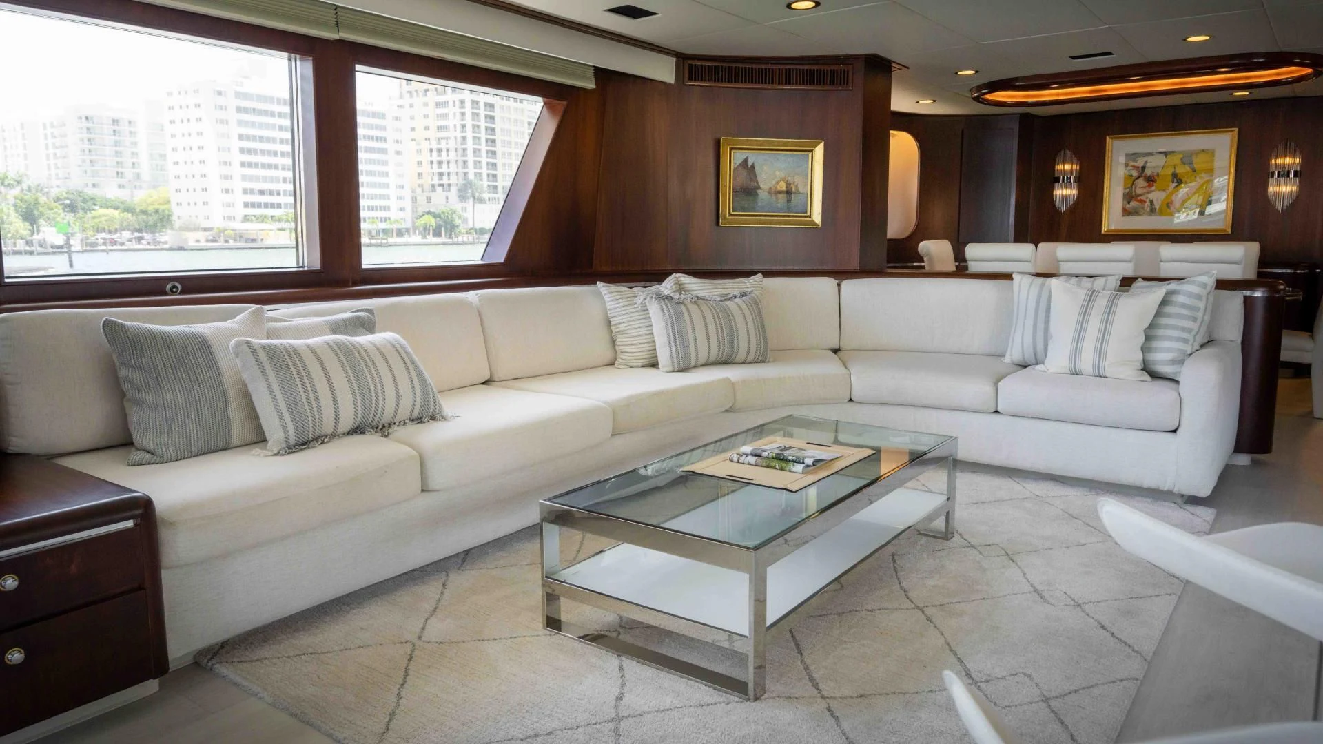 a living room with a couch and coffee table aboard ARIES Yacht for Sale